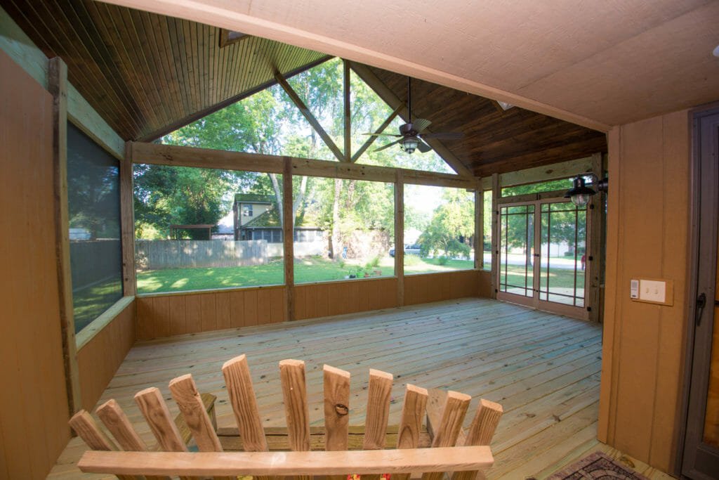 Sunroom remodel with new floors and large windows